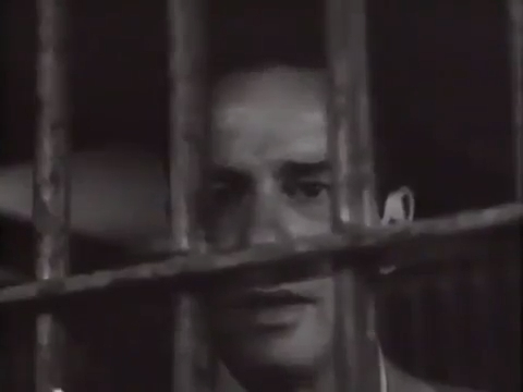 Gil Stanton visiting Howard in his jail cell.